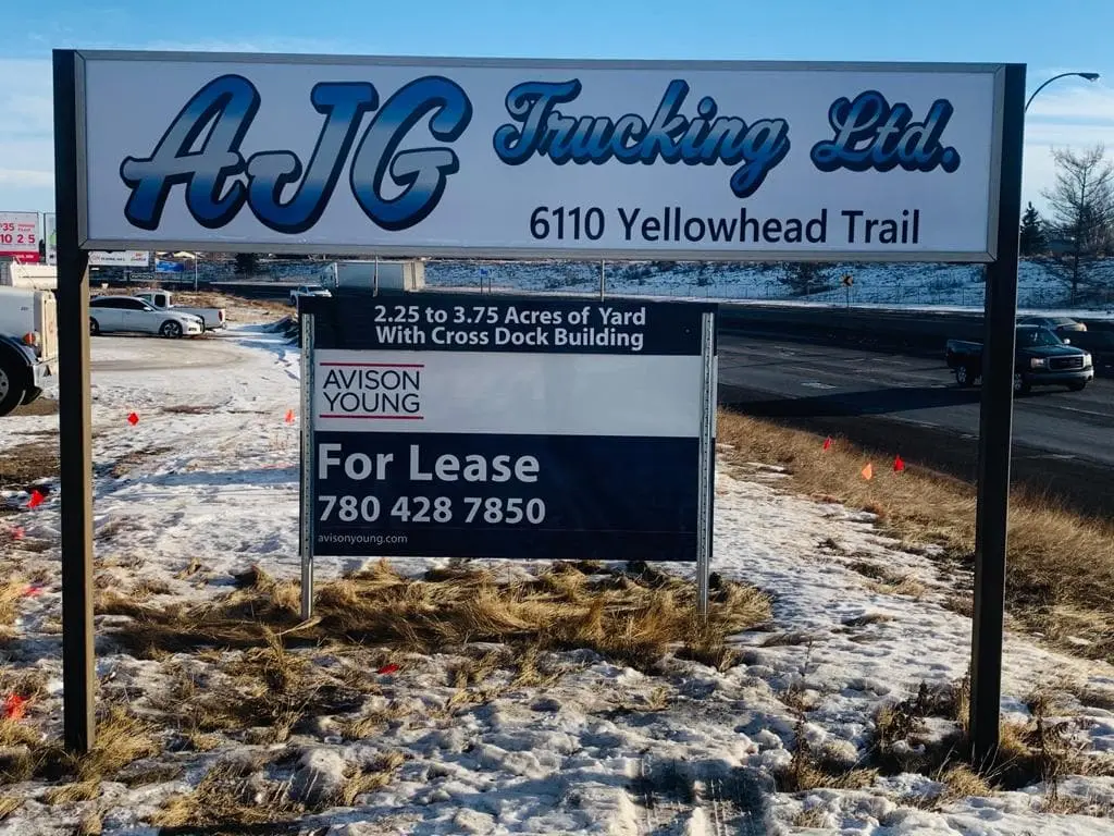 Commercial for-lease post and panel sign on a yard along Yellowhead Trail
