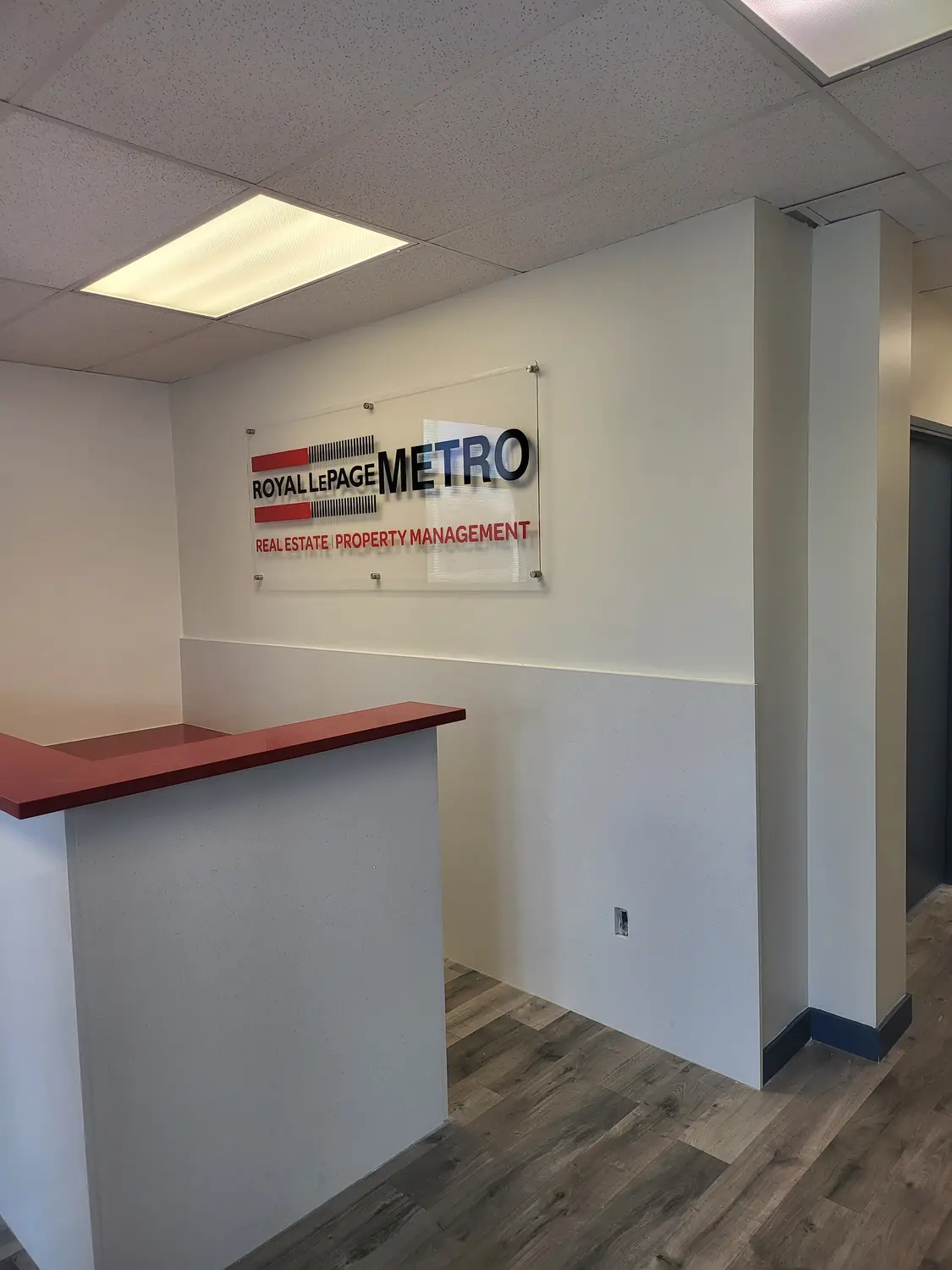 Royal LePage Metro acrylic reception sign on standoffs