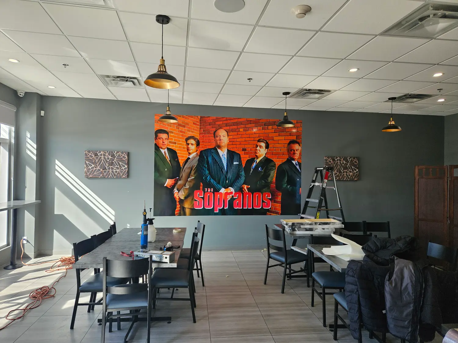 Large printed wall mural inside the Sopranos restaurant